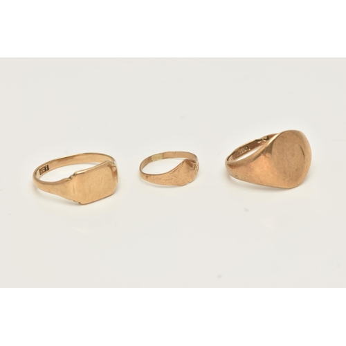 37 - THREE SIGNET RINGS, to include an oval shape signet ring with initial monogram, hallmarked 9ct gold ... 