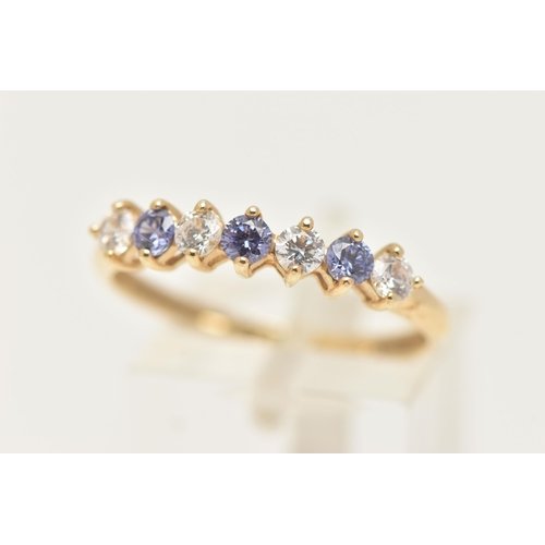 4 - A 14CT GOLD GEM SET HALF ETERNITY RING, designed as a row of seven alternating, circular cut colourl... 