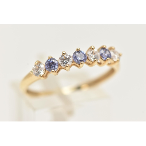 4 - A 14CT GOLD GEM SET HALF ETERNITY RING, designed as a row of seven alternating, circular cut colourl... 