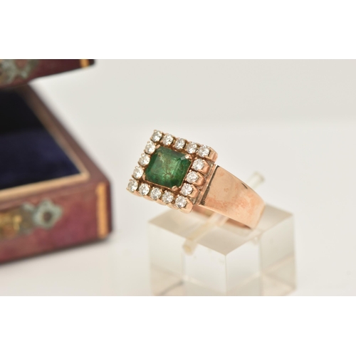 40 - AN EMERALD AND DIAMOND CLUSTER RING, set with a square shape emerald, measuring approximately 7.09 b... 