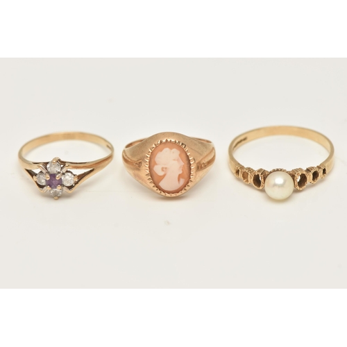 44 - A SELECTION OF THREE 9CT YELLOW GOLD RINGS, to include an amethyst and cubic zirconia cluster ring, ... 