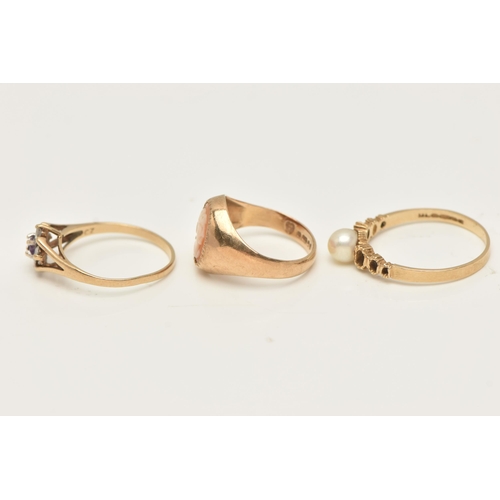 44 - A SELECTION OF THREE 9CT YELLOW GOLD RINGS, to include an amethyst and cubic zirconia cluster ring, ... 