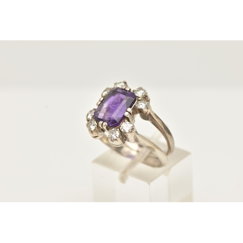 48 - A WHITE METAL AMETHYST AND DIAMOND DRESS RING, set with a rectangular amethyst, measuring approximat... 