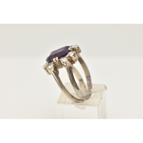 48 - A WHITE METAL AMETHYST AND DIAMOND DRESS RING, set with a rectangular amethyst, measuring approximat... 