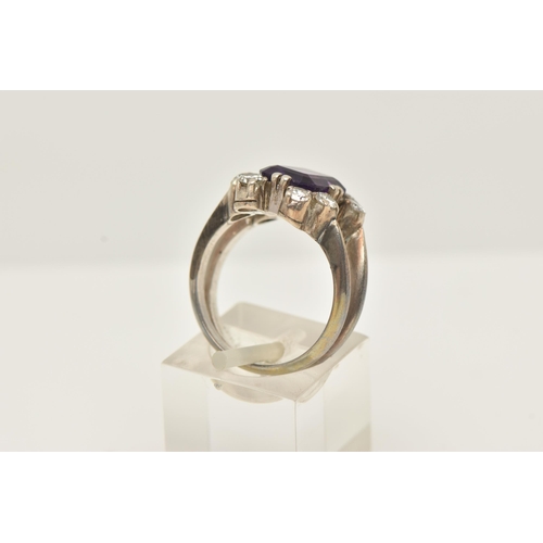 48 - A WHITE METAL AMETHYST AND DIAMOND DRESS RING, set with a rectangular amethyst, measuring approximat... 