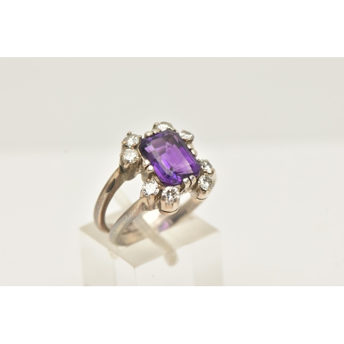 48 - A WHITE METAL AMETHYST AND DIAMOND DRESS RING, set with a rectangular amethyst, measuring approximat... 