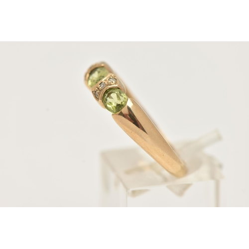 5 - A 9CT GOLD PERIDOT AND DIAMOND DRESS RING, set with three oval cut peridots with single cut diamond ... 