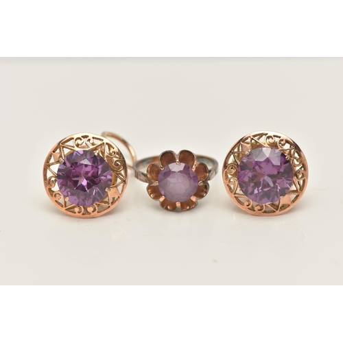 52 - A SYNTHETIC COLOUR CHANGE CORUNDUM RING AND EARRINGS, the ring set with a circular shape synthetic c... 