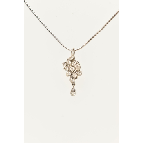 61 - A WHITE METAL DIAMOND PENDANT AND CHAIN, the floral diamond pendant set throughout with approx fourt... 