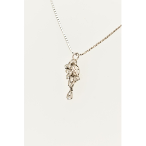 61 - A WHITE METAL DIAMOND PENDANT AND CHAIN, the floral diamond pendant set throughout with approx fourt... 