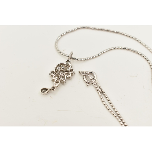 61 - A WHITE METAL DIAMOND PENDANT AND CHAIN, the floral diamond pendant set throughout with approx fourt... 