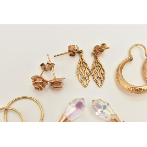 66 - A COLLECTION OF NINE YELLOW METAL EARRINGS, to include a pair of rose bud ear studs, a pair of textu... 