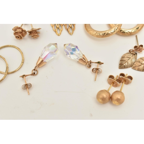 66 - A COLLECTION OF NINE YELLOW METAL EARRINGS, to include a pair of rose bud ear studs, a pair of textu... 