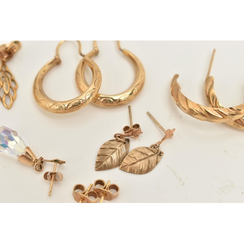 66 - A COLLECTION OF NINE YELLOW METAL EARRINGS, to include a pair of rose bud ear studs, a pair of textu... 