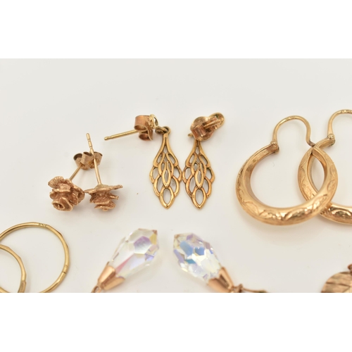 66 - A COLLECTION OF NINE YELLOW METAL EARRINGS, to include a pair of rose bud ear studs, a pair of textu... 