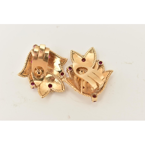 68 - A PAIR OF YELLOW METAL RUBY EARRINGS, each ear clip of foliate design set throughout with seven ruby... 