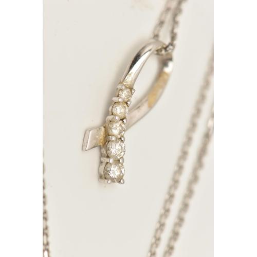 79 - A WHITE METAL DIAMOND SET PENDANT WITH A 9CT WHITE GOLD CHAIN, the ribbon pendant set with five grad... 