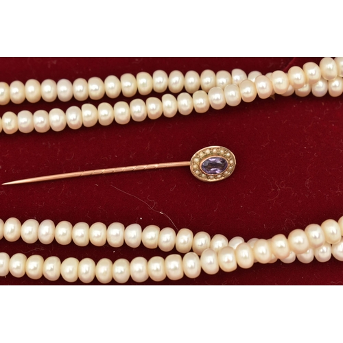 84 - A YELLOW METAL AMETHYST AND SPLIT PEARL STICK PIN AND A CULTURED BAROQUE PEARL NECKLACE, the stick p... 