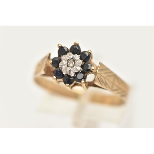 9 - A 9CT GOLD DIAMOND AND SAPPHIRE CLUSTER RING, set with a central single cut diamond illusion set wit... 