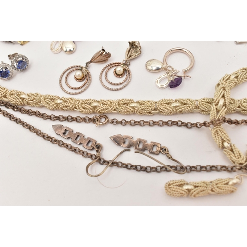 101 - AN ASSORTMENT OF WHITE METAL JEWELLERY, to include a large silver foliate pattern locket, hallmarked... 