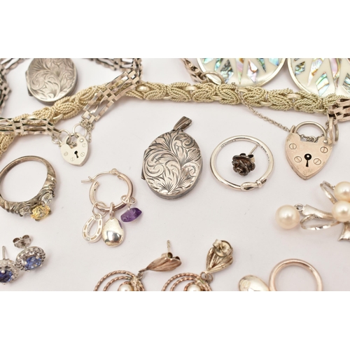 101 - AN ASSORTMENT OF WHITE METAL JEWELLERY, to include a large silver foliate pattern locket, hallmarked... 