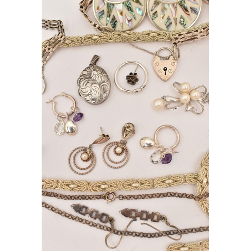 101 - AN ASSORTMENT OF WHITE METAL JEWELLERY, to include a large silver foliate pattern locket, hallmarked... 