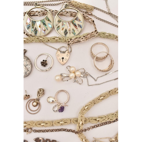 101 - AN ASSORTMENT OF WHITE METAL JEWELLERY, to include a large silver foliate pattern locket, hallmarked... 