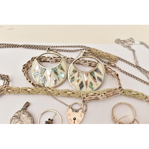 101 - AN ASSORTMENT OF WHITE METAL JEWELLERY, to include a large silver foliate pattern locket, hallmarked... 