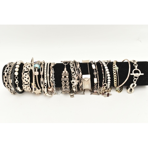 106 - A BLACK SUEDE BRACELET DISPLAY PIECE WITH SILVER AND WHITE METAL BRACELETS, to include a silver flat... 