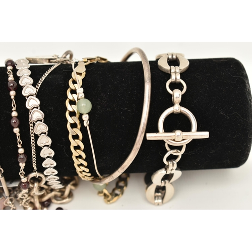 106 - A BLACK SUEDE BRACELET DISPLAY PIECE WITH SILVER AND WHITE METAL BRACELETS, to include a silver flat... 