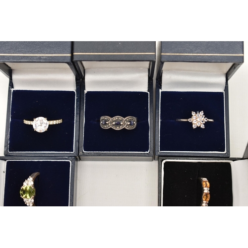 110 - A SELECTION OF TEN WHITE METAL GEM SET RINGS, various designs, set with assorted cubic zirconia or s... 