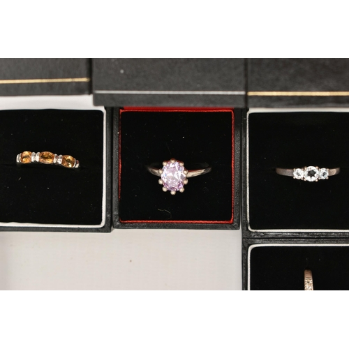 110 - A SELECTION OF TEN WHITE METAL GEM SET RINGS, various designs, set with assorted cubic zirconia or s... 