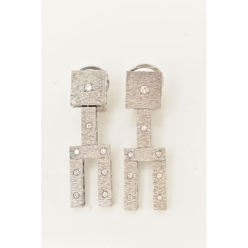 89 - A PAIR OF WHITE METAL DIAMOND SET DROP EARRINGS, bark effect textured articulated drop earrings, eac... 