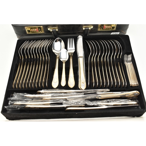 134 - A BRIEFCASE CANTEEN OF CUTLERY, twelve person table setting of two tone stainless steel cutlery, inc... 