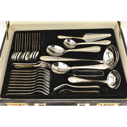 134 - A BRIEFCASE CANTEEN OF CUTLERY, twelve person table setting of two tone stainless steel cutlery, inc... 