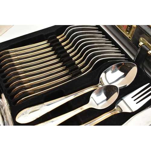 134 - A BRIEFCASE CANTEEN OF CUTLERY, twelve person table setting of two tone stainless steel cutlery, inc... 