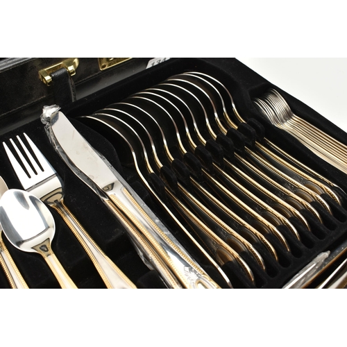 134 - A BRIEFCASE CANTEEN OF CUTLERY, twelve person table setting of two tone stainless steel cutlery, inc... 