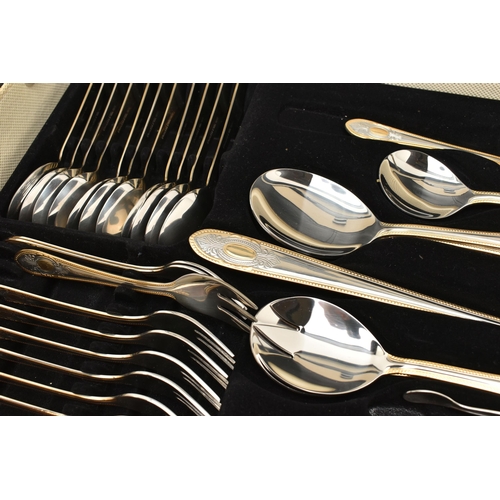 134 - A BRIEFCASE CANTEEN OF CUTLERY, twelve person table setting of two tone stainless steel cutlery, inc... 