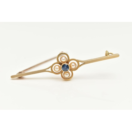 183 - AN EARLY 20TH CENTURY SAPPHIRE AND SPLIT PEARL BAR BROOCH, the central circular sapphire within a sp... 