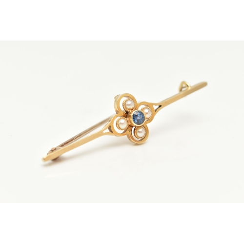 183 - AN EARLY 20TH CENTURY SAPPHIRE AND SPLIT PEARL BAR BROOCH, the central circular sapphire within a sp... 