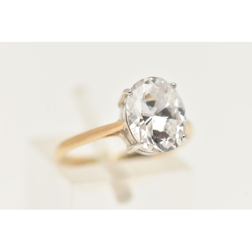 187 - A 9CT GOLD CUBIC ZIRCONIA RING, designed with an oval cut colourless cubic zirconia in a four claw w... 