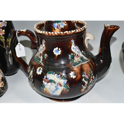 302 - A LARGE MEASHAM POTTERY BARGEWARE TEAPOT, decorated in traditional  design having typical moulded fl... 