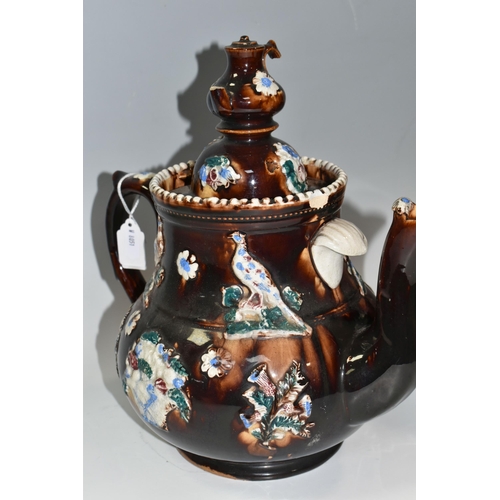 302 - A LARGE MEASHAM POTTERY BARGEWARE TEAPOT, decorated in traditional  design having typical moulded fl... 