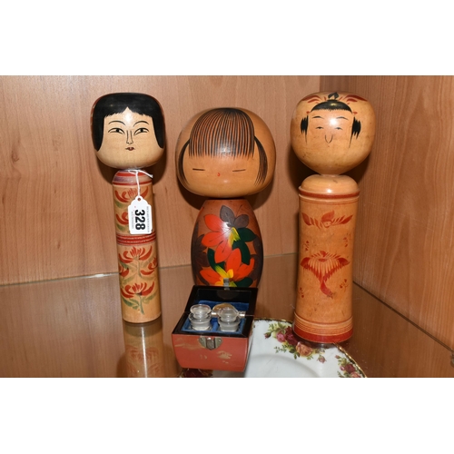 328 - THREE JAPANESE KOKESHI WOODEN DOLLS AND A CASE OF VAUTINE'S SCENT BOTTLES, comprising both vintage m... 