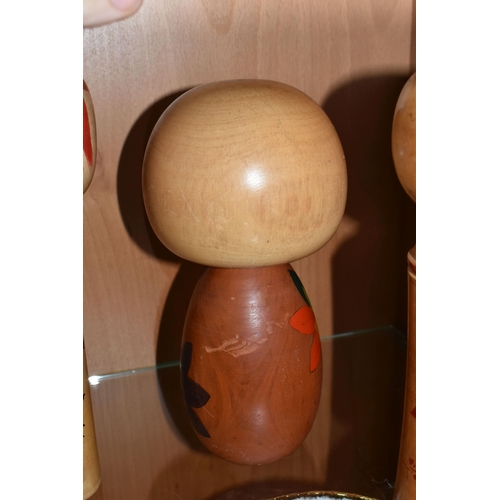 328 - THREE JAPANESE KOKESHI WOODEN DOLLS AND A CASE OF VAUTINE'S SCENT BOTTLES, comprising both vintage m... 