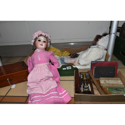 340 - TWO BOXES AND LOOSE DOLLS, MICROSCOPE, WRITING SLOPE AND SUNDRY ITEMS, to include a Heubach Koppelsd... 