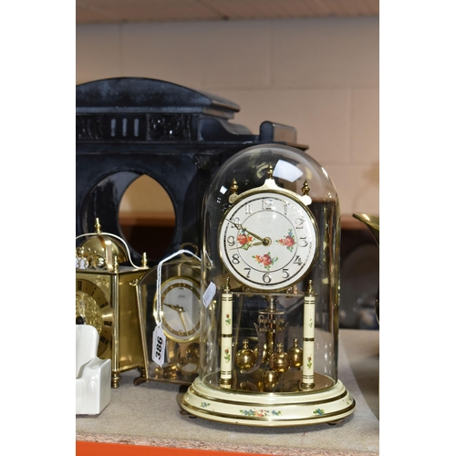 386 - A GROUP OF CLOCKS AND ORNAMENTS to include a Smiths mantel clock (pendulum and key included) with de... 