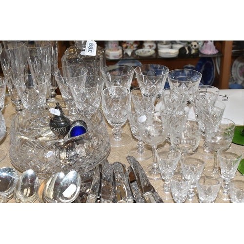 389 - A QUANTITY OF MOSTLY CRYSTAL CUT GLASSWARE three green Wedgwood Brancaster descending candlesticks w... 