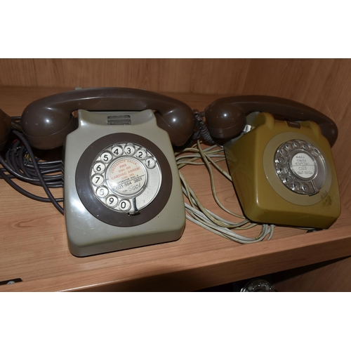 413 - A GROUP OF EIGHT ROTARY DIAL VINTAGE TELEPHONES to include seven GEN 746 telephones in various shade... 