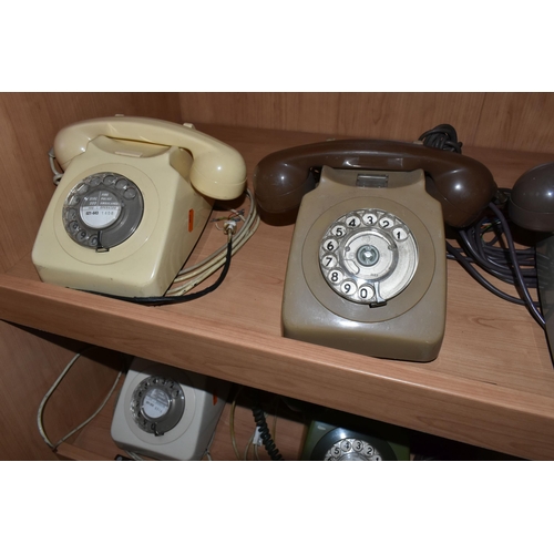 413 - A GROUP OF EIGHT ROTARY DIAL VINTAGE TELEPHONES to include seven GEN 746 telephones in various shade... 